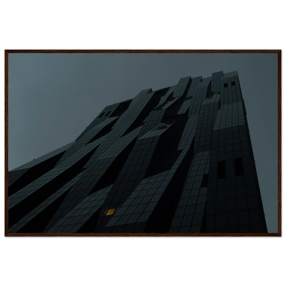 Bluish low angle view of a modern skyscraper with bold geometric lines and dark textured facade on Wooden framed wall art