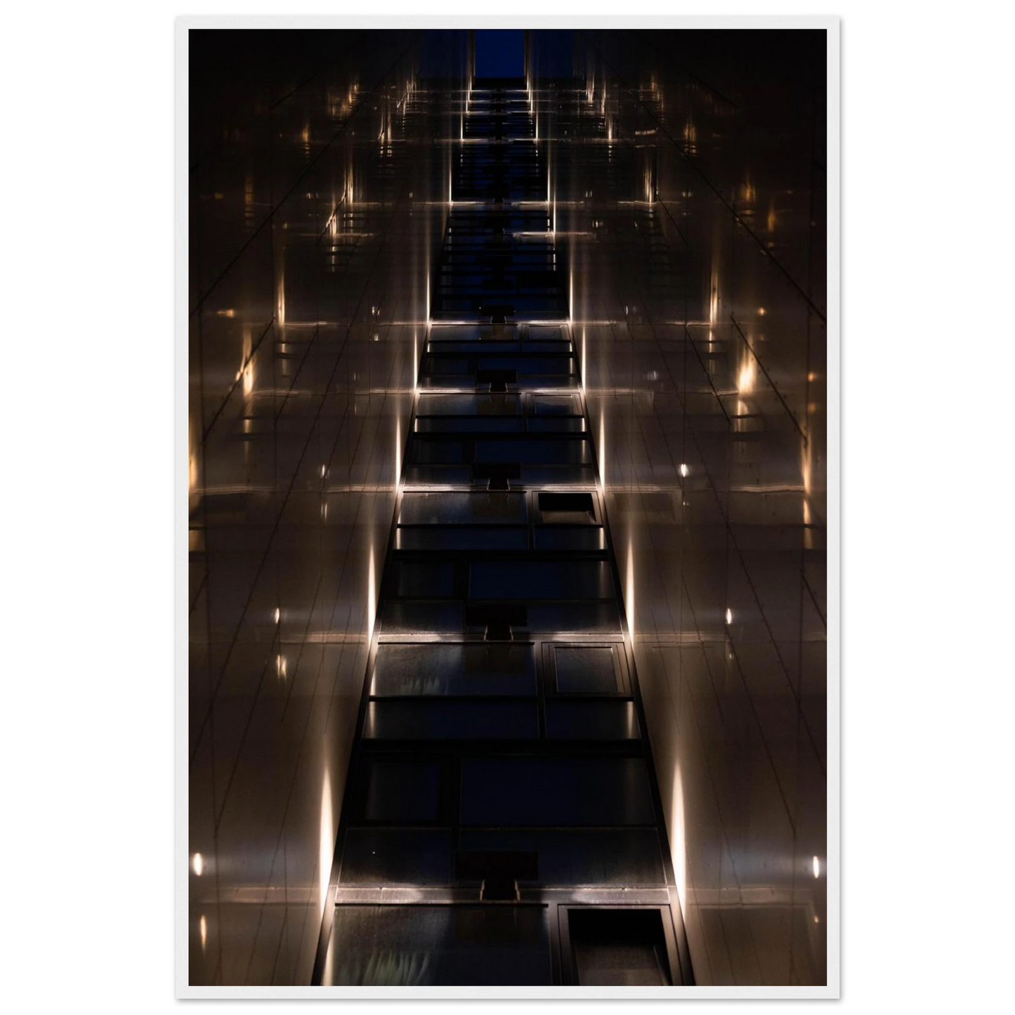 Low angle view looking up a narrow corridor-like passage between two skyscraper walls lined with rows of windows stretching toward the sky on wooden framed wall art