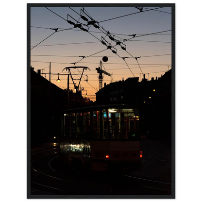 Wooden framed wall art featuring a tram the Nightline driving between houses under power lines during a golden sunset