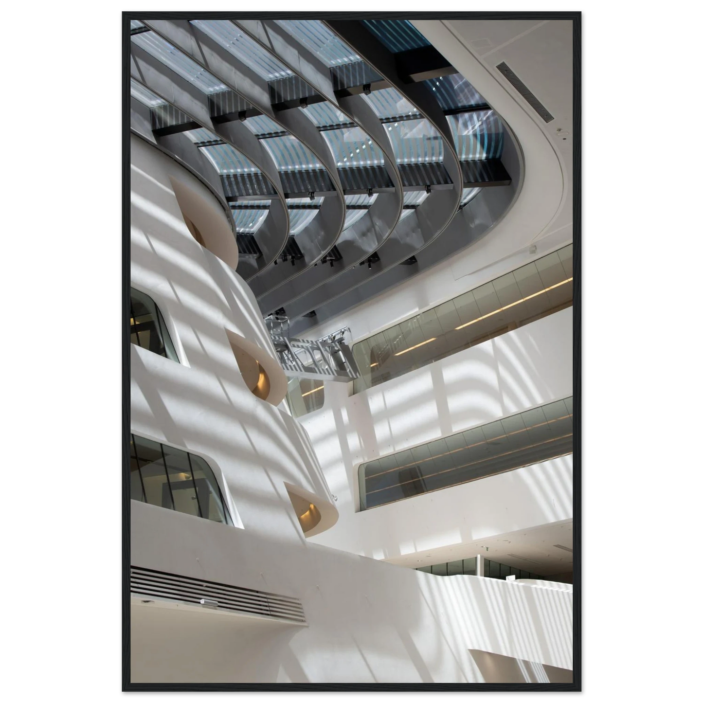 Interior view of the Library of WU (Vienna University of Economics and Business) on wooden frame wall art featuring modern architecture with multiple floors and open study spaces