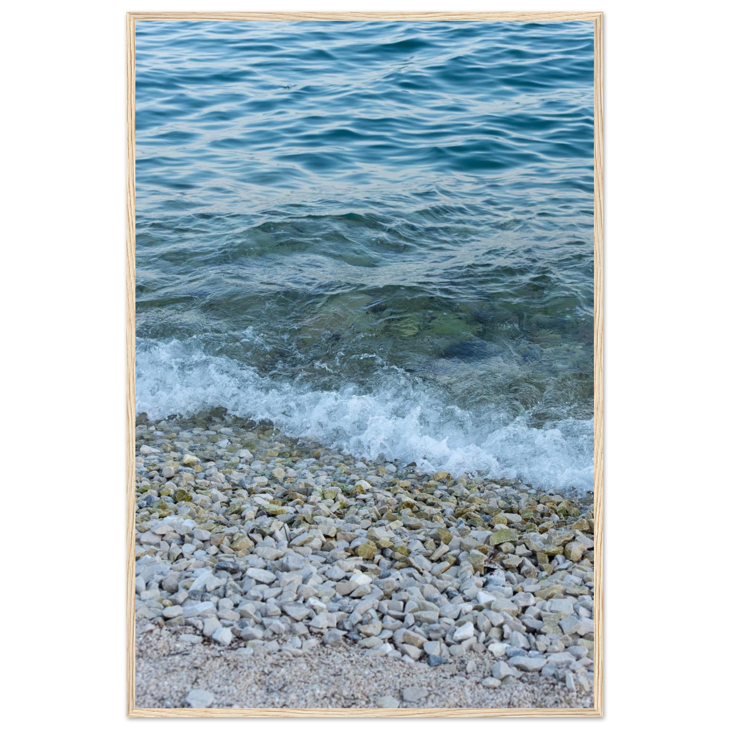 Aerial view ocean beach with wood frame, top down drone shot of blue sea foam and pebbles