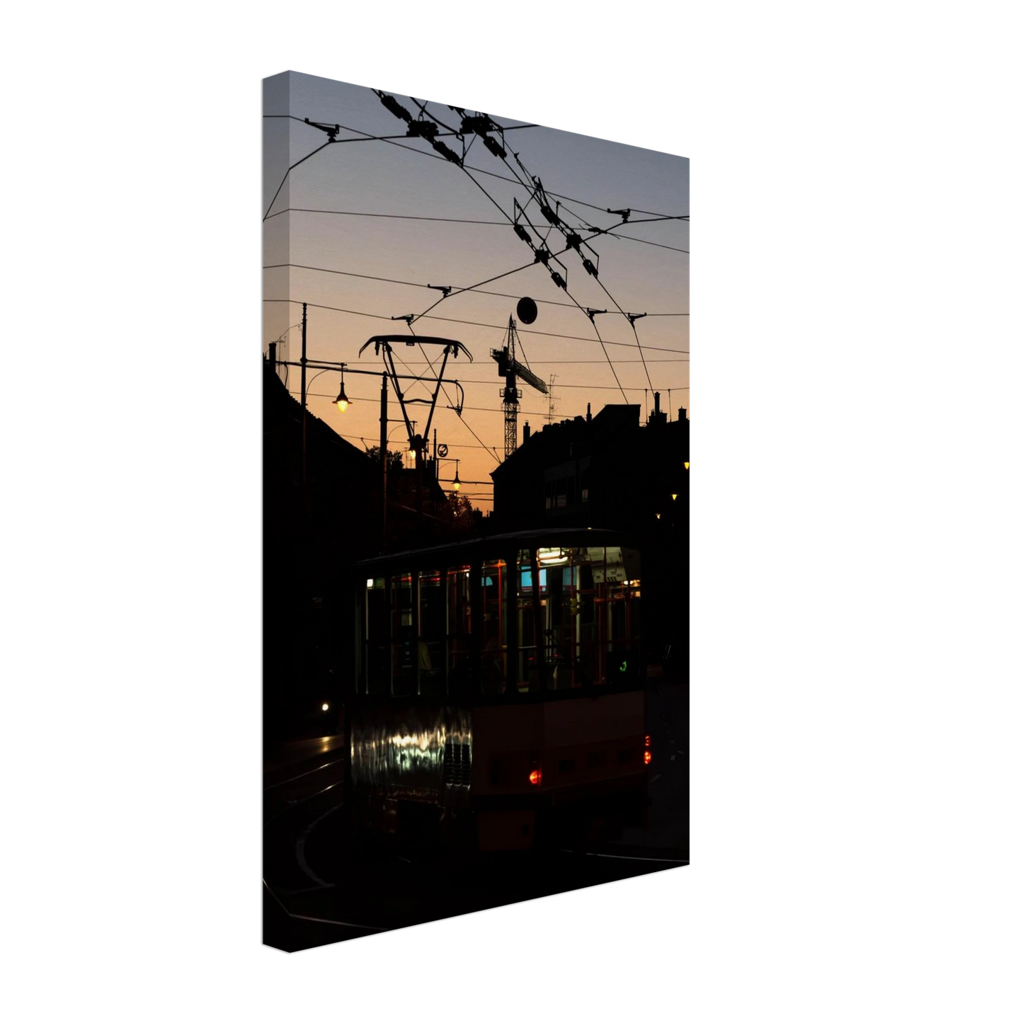 Canvas Print wall art featuring a tram the Nightline driving between houses under power lines during a golden sunset