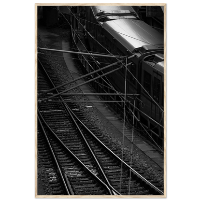 Black and white aerial view of metro train and railway tracks in an urban underground or elevated rail system on wooden framed wall art