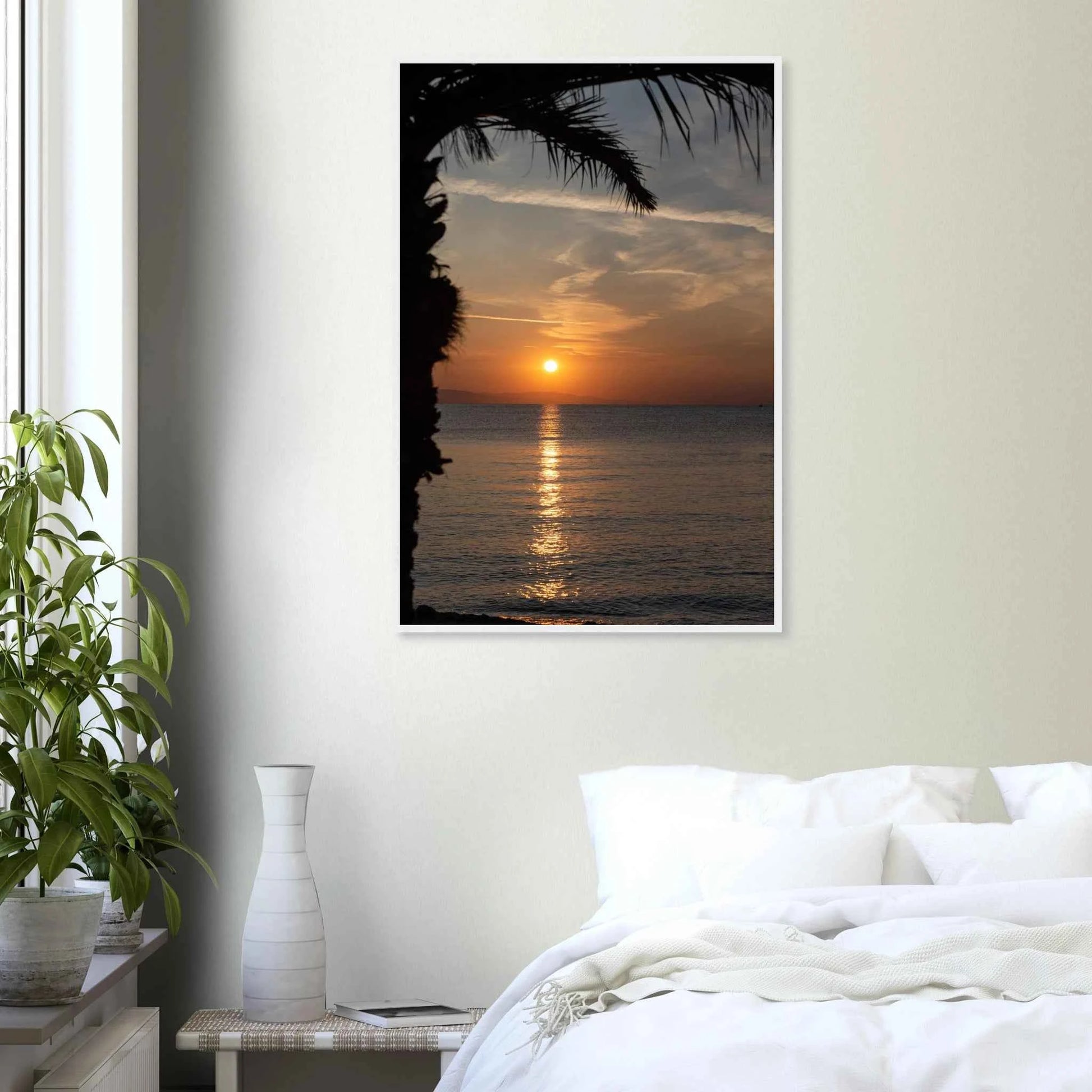 Wooden framed wall art Sunset over calm water with golden reflections, framed by tree branches in a peaceful natural landscape on the wall in the Bedroom