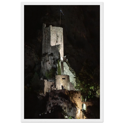 Wooden framed wall art of an ancient stone bastion decorated with green climbing plants against a dark background in Shadow Keep