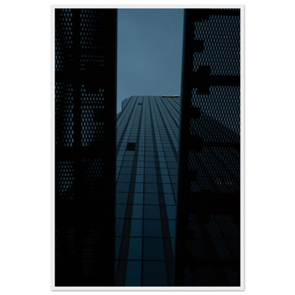 Low angle view looking up at a tall glass skyscraper framed between two metal structural elements on wooden framed wall art