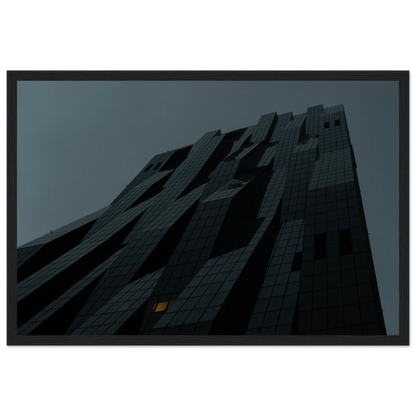 Bluish low angle view of a modern skyscraper with bold geometric lines and dark textured facade on Wooden framed wall art