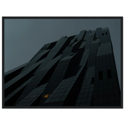 Bluish low angle view of a modern skyscraper with bold geometric lines and dark textured facade on Wooden framed wall art