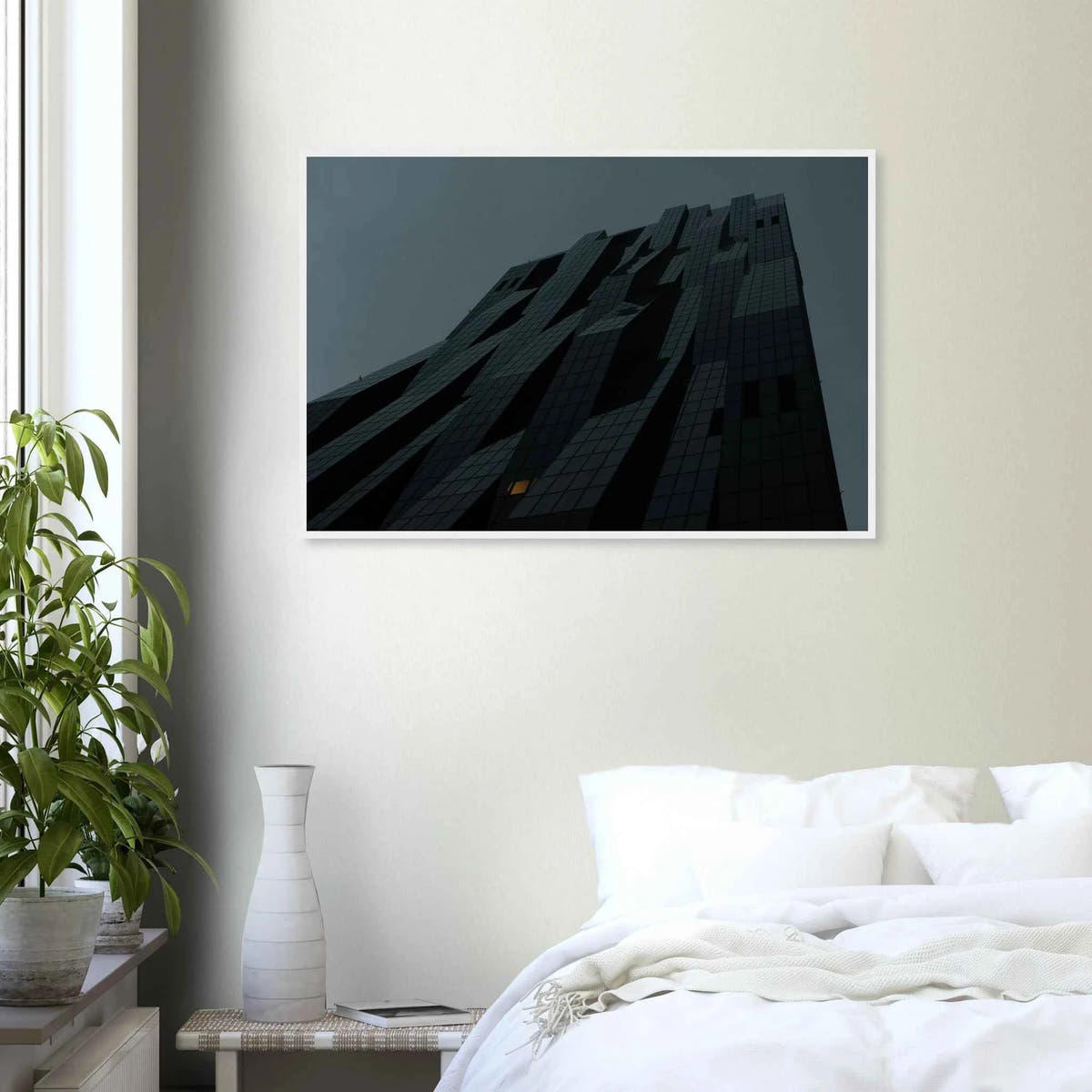 Bluish low angle view of a modern skyscraper with bold geometric lines and dark textured facade on Wooden framed wall art on the wall in the Bedroom