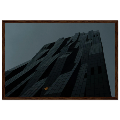 Bluish low angle view of a modern skyscraper with bold geometric lines and dark textured facade on Wooden framed wall art