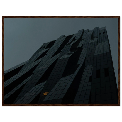 Bluish low angle view of a modern skyscraper with bold geometric lines and dark textured facade on Wooden framed wall art
