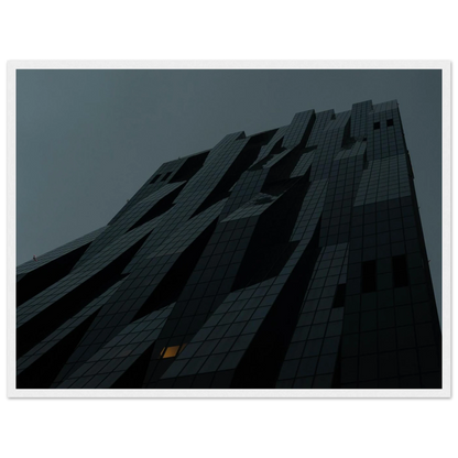 Bluish low angle view of a modern skyscraper with bold geometric lines and dark textured facade on Wooden framed wall art