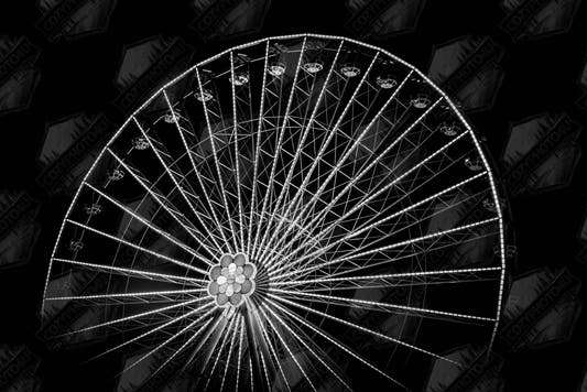 Digital Picture art Black and white night photo of the Vienna Prater Giant Ferris Wheel (Wiener Riesenrad) with illuminated spokes forming a circular pattern against the dark sky